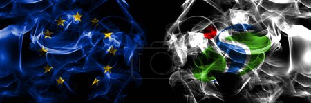 Foto de Flags of EU, European Union vs Japan, Japanese, Shibetsu, Hokkaido, Kamikawa, Subprefecture. Smoke flag placed side by side on black background. - Imagen libre de derechos