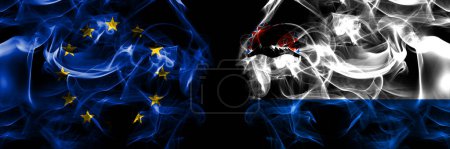 Téléchargez les photos : Flags of EU, European Union vs Russia, Russian, Kamchatka Krai. Smoke flag placed side by side on black background. - en image libre de droit