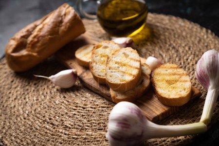 Photo for Classic italian bruschette grilled bread slices with garlic and olive oil - Royalty Free Image