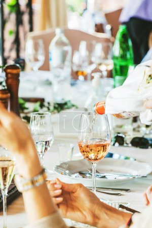 Photo for Closeup view glasses of wine on wedding table at restaurant. - Royalty Free Image