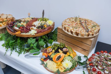 Photo for Delicious catering buffet with a variety of gourmet appetizers served at celebration. - Royalty Free Image