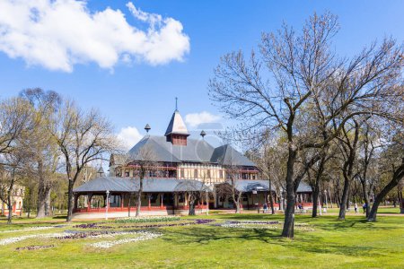 Photo for Stately palace stands in a park with trees, its retro Art Nouveau style standing out among the peaceful scenery of Palic lake, nature park. Serbia, Europe. - Royalty Free Image