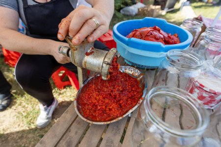 Photo for Process of making Balkan food by roast red pepper, spread called Ajvar, traditional prepare. - Royalty Free Image