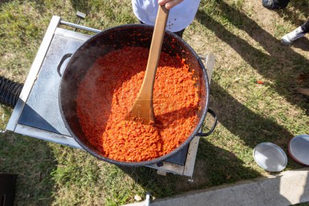 Photo for Process of making Balkan food by roast red pepper, spread called Ajvar, traditional prepare. - Royalty Free Image