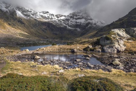 Mystical Serenity: Tristaina Lakes Embraced by Mist in Andorra