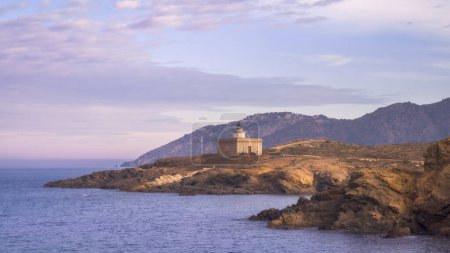 S'Arenella Lighthouse at Dusk as seen from the Coastal Path from Llanca to Port de la Selva, Catalonia