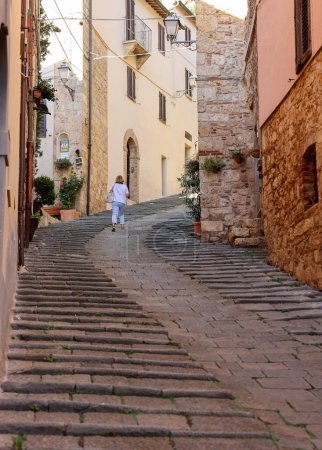Photo for Massa Marittima, Italy - Sept 11, 2022: Steep and narrow street in old town of Massa Marittima, Italy - Royalty Free Image