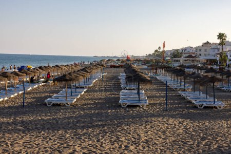 Photo for Torremolinos, Spain - September 9, 2023: People relaxing on La Carihuela beach in Torremolinos, Malaga, Costa del Sol, Spain - Royalty Free Image
