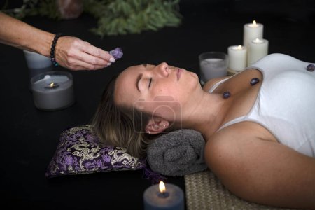 woman and energy healing  in front of black background