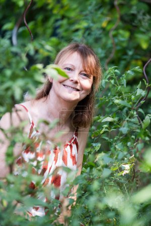 Photo for Senior woman gardening in her kitchen garden - Royalty Free Image