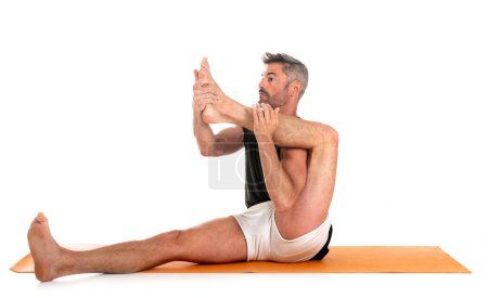 Photo for Man and hatha yoga asana in front of white background - Royalty Free Image