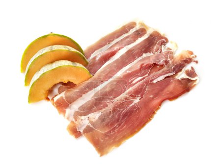 Photo for Slice of cured ham serano and melon in front of white background - Royalty Free Image