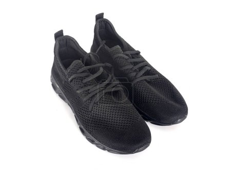 Téléchargez les photos : Chaussures noires devant fond blanc - en image libre de droit