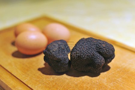 Photo for Black truffles,  tuber melanosporum, on a table - Royalty Free Image