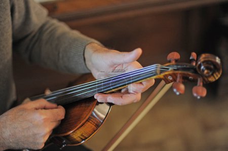 Photo for Picture of a violin with score and man - Royalty Free Image