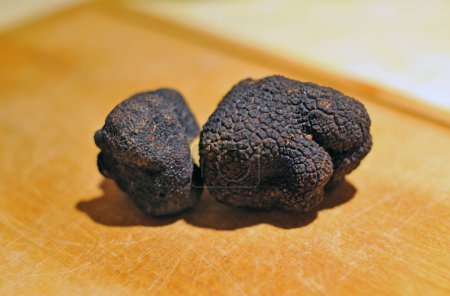 black truffles,  tuber melanosporum, on a table