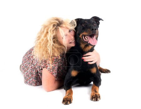 sheepdog from Beauce and woman in front of white background