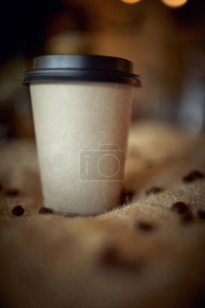 Photo for Close up of cardboard cup of coffee to go, with plastic cover - Royalty Free Image