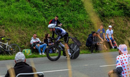 Photo for Louverne, France - June 30, 2021: The Australian cyclist Simon Clarke, of Team Qhubeka NextHashrides in the rain during the stage 5 (Individual Time Trial) of Le Tour de France 2021. - Royalty Free Image