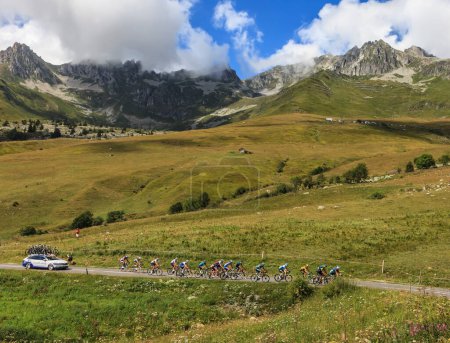 Photo for Col de la Madeleine, France - August 24, 2020: The peloton climbing the road to Col de la Madeleine during the 3rd stage of Criterium du Dauphine 2020. - Royalty Free Image