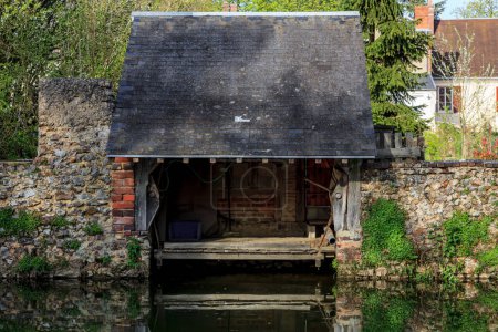 Photo for Image of a traditional French laundry on the riverside of the River Ozanne in Brou in Central France. This image is part of my project "Small localities in France" Check my gallery for more such images. - Royalty Free Image