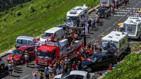 Photo for Pas de Peyrol, France - July 6,2016: Kleber Caravan during the passing of the Publicity Caravan on the road to Pas de Pyerol (Puy Mary) in Cantal,in the Central Massif, during the stage 5 of Tour de France on July 6, 2016. Kleber is a famous European - Royalty Free Image