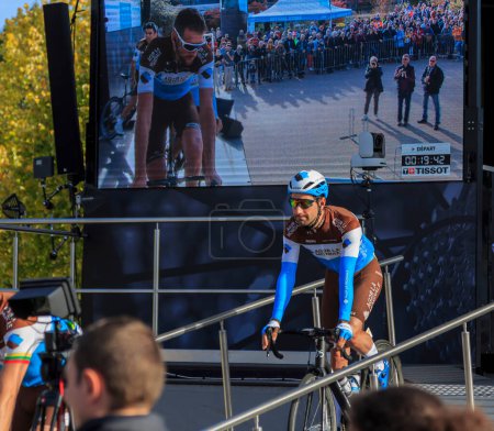 Photo for Chartres, France - October 13, 2019: The French cyclist Julien Duval of Team AG2R La Mondiale rides down from the podium in Chartres, during the teams presentation before the autumn French cycling race Paris-Tours 2019 - Royalty Free Image