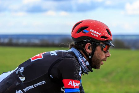 Photo for Vendome,France- March 7,2016:The Dutch cyclist Laurens ten Dam of Team Giant - Alpecin riding on a dirty road,Tertre de la Motte, in Vendome, during the first stage of Paris-Nice 2016. - Royalty Free Image