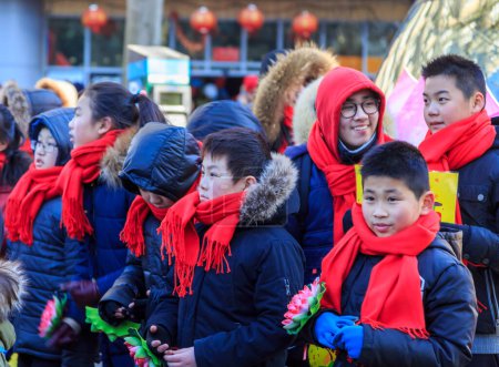 Photo for Paris,France-February 25,2018: Environmental portrait of group of chinese childrens during the 2018 Chinese New year parade in Paris. - Royalty Free Image