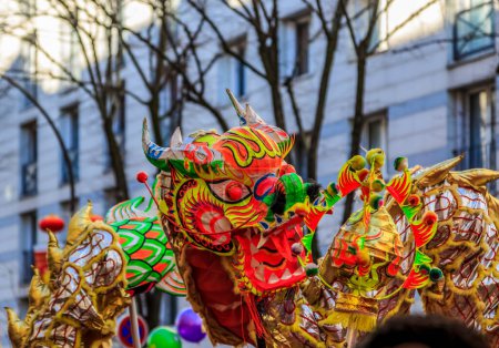 Photo for Paris,France-February 25,2018: Detail of the traditional Chinese Dragon performing in the street during the 2018 Chinese New Year parade in Paris. - Royalty Free Image