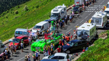 Photo for Pas de Peyrol, France - July 6,2016: Teisseire Caravan during the passing of the Publicity Caravan on the road to Pas de Pyerol (Puy Mary) in Cantal,in the Central Massif, during the stage 5 of Tour de France on July 6, 2016. Teisseire produces fruit - Royalty Free Image