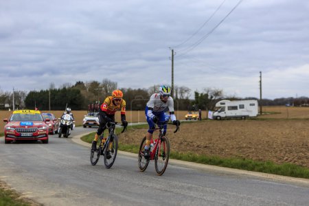 Photo for La Celle-les-Bordes, France - March 05, 2023: Paul Ourselin of Total Energie Team and Jonas Gregaard of Uno-X Pro Cycling Team riding in the breakaway during Paris-Nice 2023. - Royalty Free Image