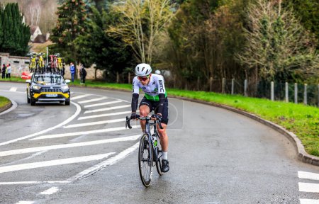 Photo for Beulle, France - March 10, 2019: The South African cyclist Louis Meintjes of  Team Dimension Data rides on Cote de Beulle during the stage 1 of Paris-Nice 2019. - Royalty Free Image