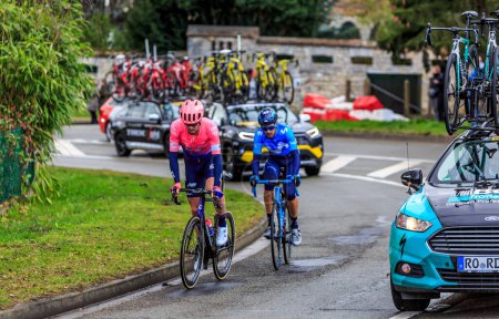 Photo for Beulle, France - March 10, 2019: The British cyclist Daniel McLay of  EF Education First Team and the Spanish cyclist Hector Carretero Milla of Movistar Team ride on Cote de Beulle during the stage 1 of Paris-Nice 2019. - Royalty Free Image
