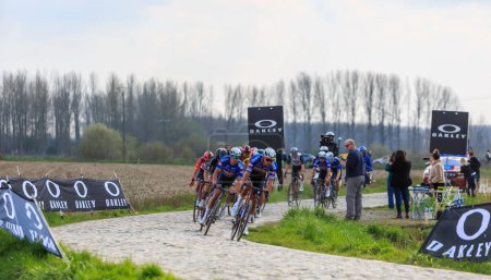 Photo for Brillon, France - April 09, 2023: Mathieu van der Poel, the winner of the race, rides in front of the pleoton duirng Paris-Roubaix 2023. - Royalty Free Image