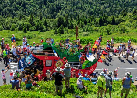 Photo for Pas de Peyrol, France - July 6,2016: Cofidis Caravan during the passing of the Publicity Caravan on the road to Pas de Pyerol (Puy Mary) in Cantal,in the Central Massif, during the stage 5 of Tour de France on July 6, 2016. Cofidis is an important Fr - Royalty Free Image