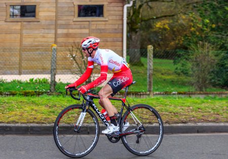Photo for Beulle, France - March 10, 2019: The French cyclist Nicolas Edet of  Team Cofidis rides on Cote de Beulle during the stage 1 of Paris-Nice 2019. - Royalty Free Image