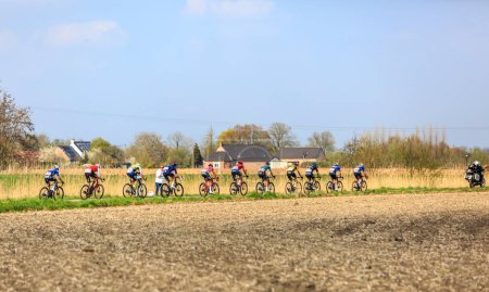 Photo for Brillon, France - April 09, 2023: Mathieu van der Poel, the winner of the race, rides in front of the pleoton duirng Paris-Roubaix 2023. - Royalty Free Image