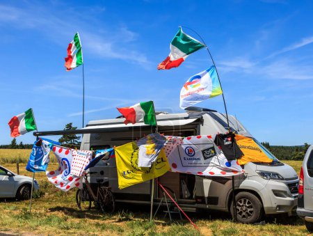 Photo for Cote de la Fage, France - July 16, 2022: A specially decorated camping car belonging to a fan is parked on the roadside along Cote de la Fage in the Cevennes Mountains during the 14th stage of Le Tour de France 2022. - Royalty Free Image