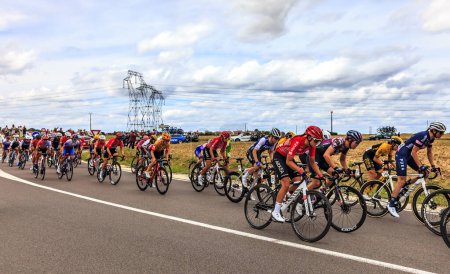 Photo for Rubelles, France - July 25th, 022: The peloton rides in the field during the second stage of Le Tour de France femmes 2022 - Royalty Free Image