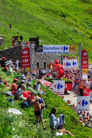 Photo for Pas de Peyrol, France - July 6,2016: Vittel Caravan during the passing of the Publicity Caravan on the road to Pas de Pyerol (Puy Mary) in Cantal,in the Central Massif, during the stage 5 of Tour de France on July 6, 2016. Vittel is a French bottled - Royalty Free Image