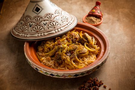 Photo for Traditional moroccan chicken tajine with vegetables and dried grapes - Royalty Free Image