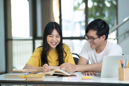 Photo for Young woman and man studying for a test or an exam. Tutor books with friends. Young students campus helps friend catching up and learning. - Royalty Free Image
