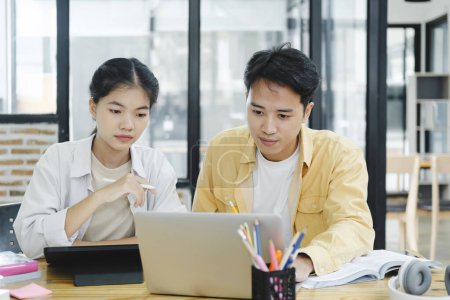 Photo for Learning, education and school concept. Young woman and man studying for a test or an exam. Tutor books with friends. Young students campus helps friend catching up and learning. - Royalty Free Image