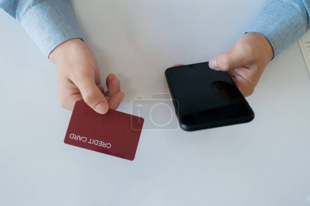 Photo for Man shopping online and pay for this product by credit card - Royalty Free Image