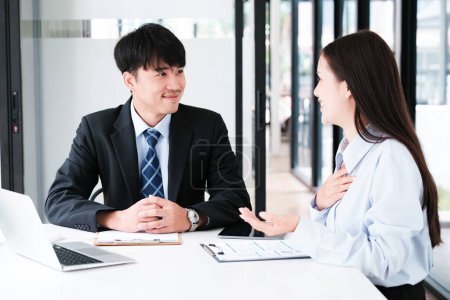 Photo for A candidate engaged in a job interview with a hiring manager, discussing qualifications and employment opportunities. - Royalty Free Image