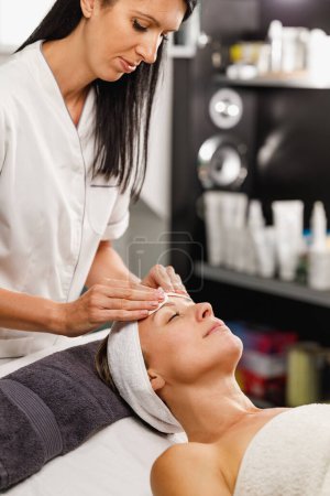 Photo for Shot of a beautiful mature woman on a facial treatment at the beauty salon. - Royalty Free Image
