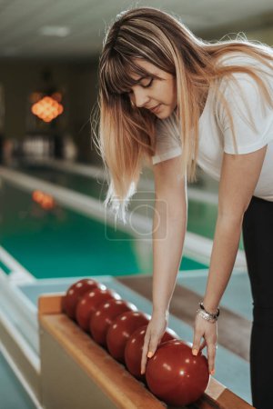 Photo for Shot of a cute girl preparing to playing in the bowling club. - Royalty Free Image