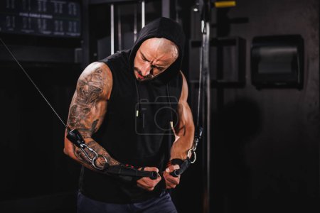 Photo for Shot of a young muscular bodybuilder man doing hard training for his chest muscles at the gym. - Royalty Free Image