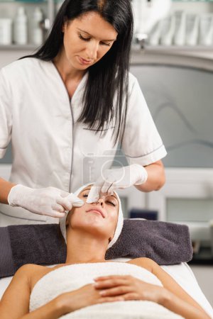 Photo for Shot of a beautiful young woman on a facial treatment at the beauty salon. - Royalty Free Image